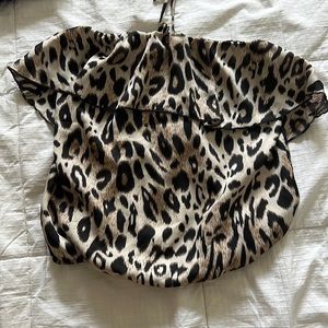 Leopard Print top with ruffle and neck tie. Size small